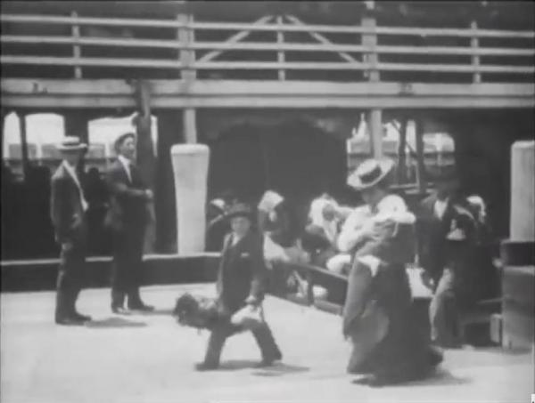 Emigrants Landing at Ellis Island logo